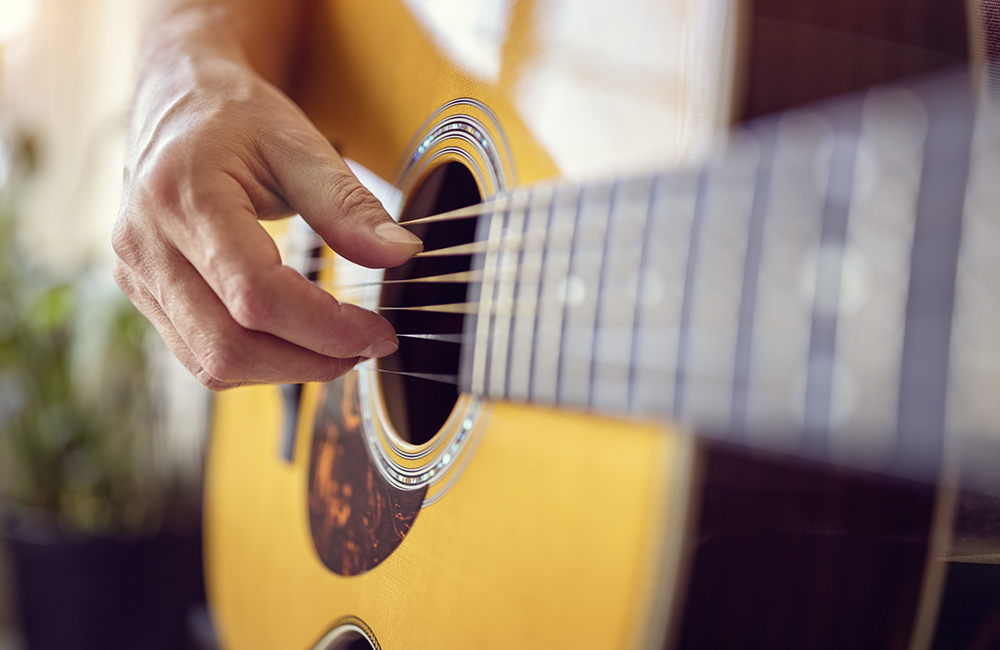 Man playing an acoustic guitar